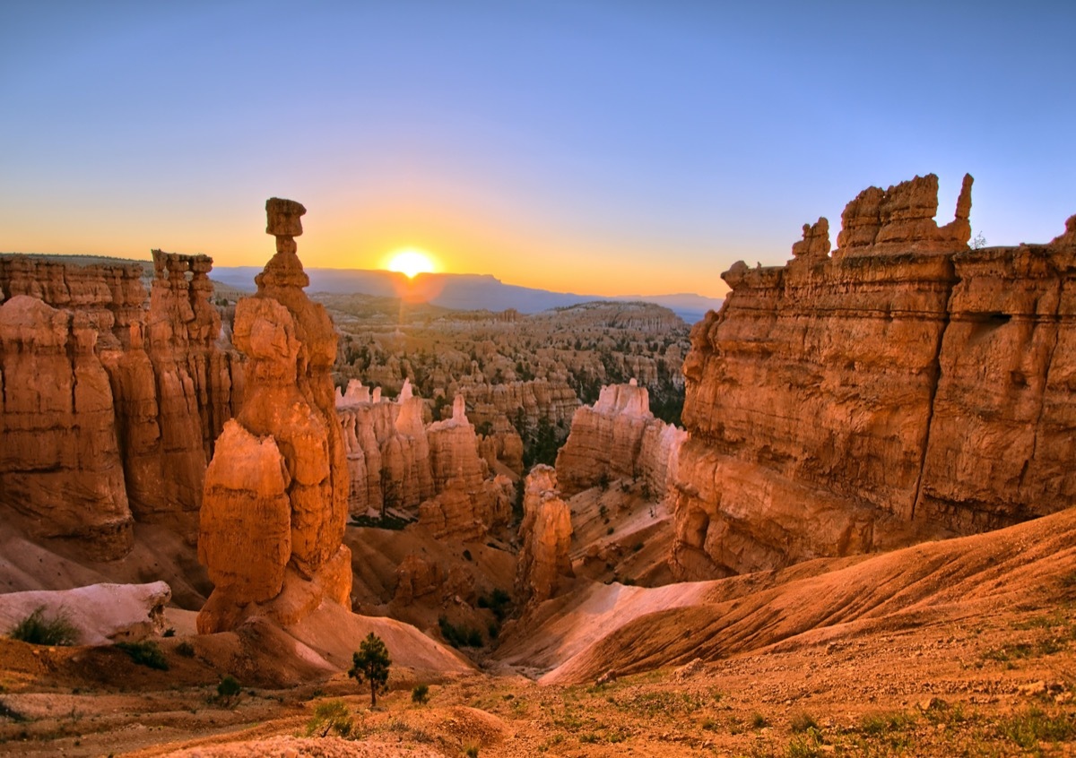 orange rocks and mountains in Bryce Canyon National Park, Utah at sunrise