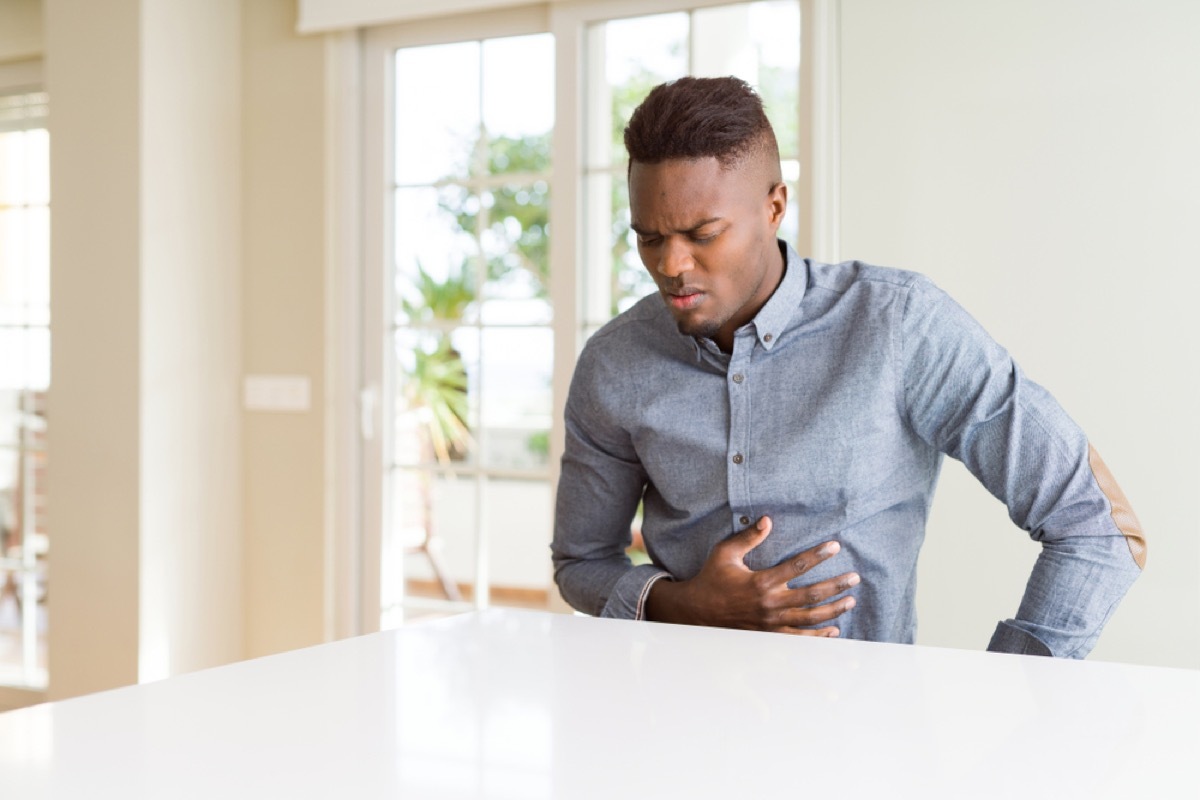 young man with stomach pain