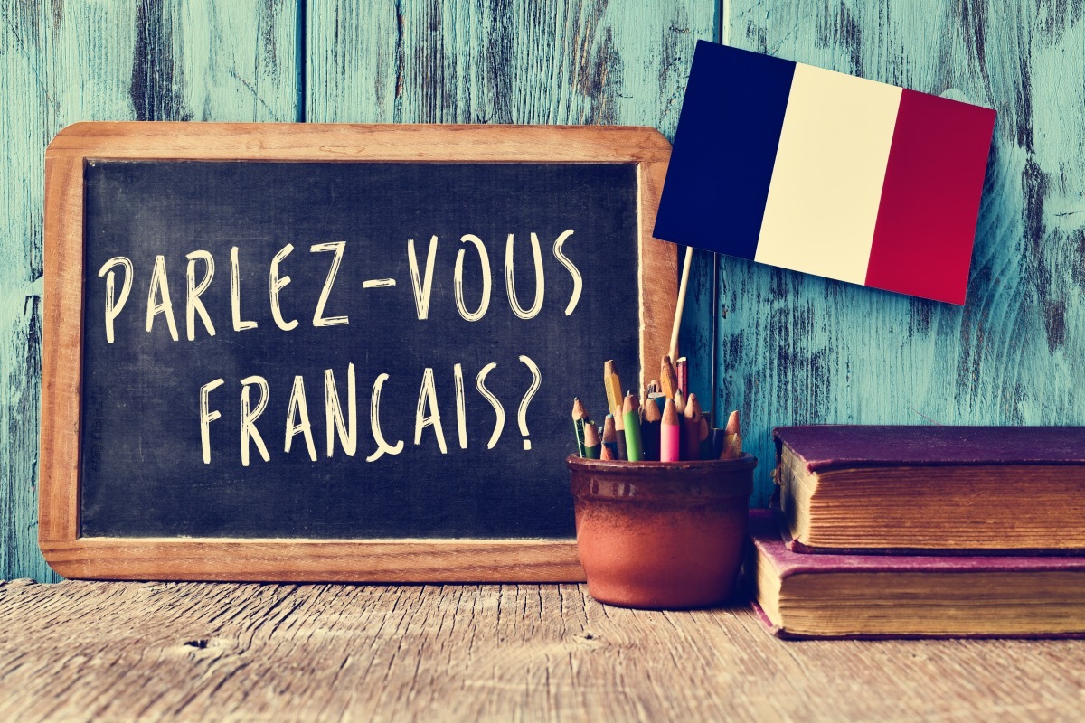 French Sentence on Chalk Board with French Flag