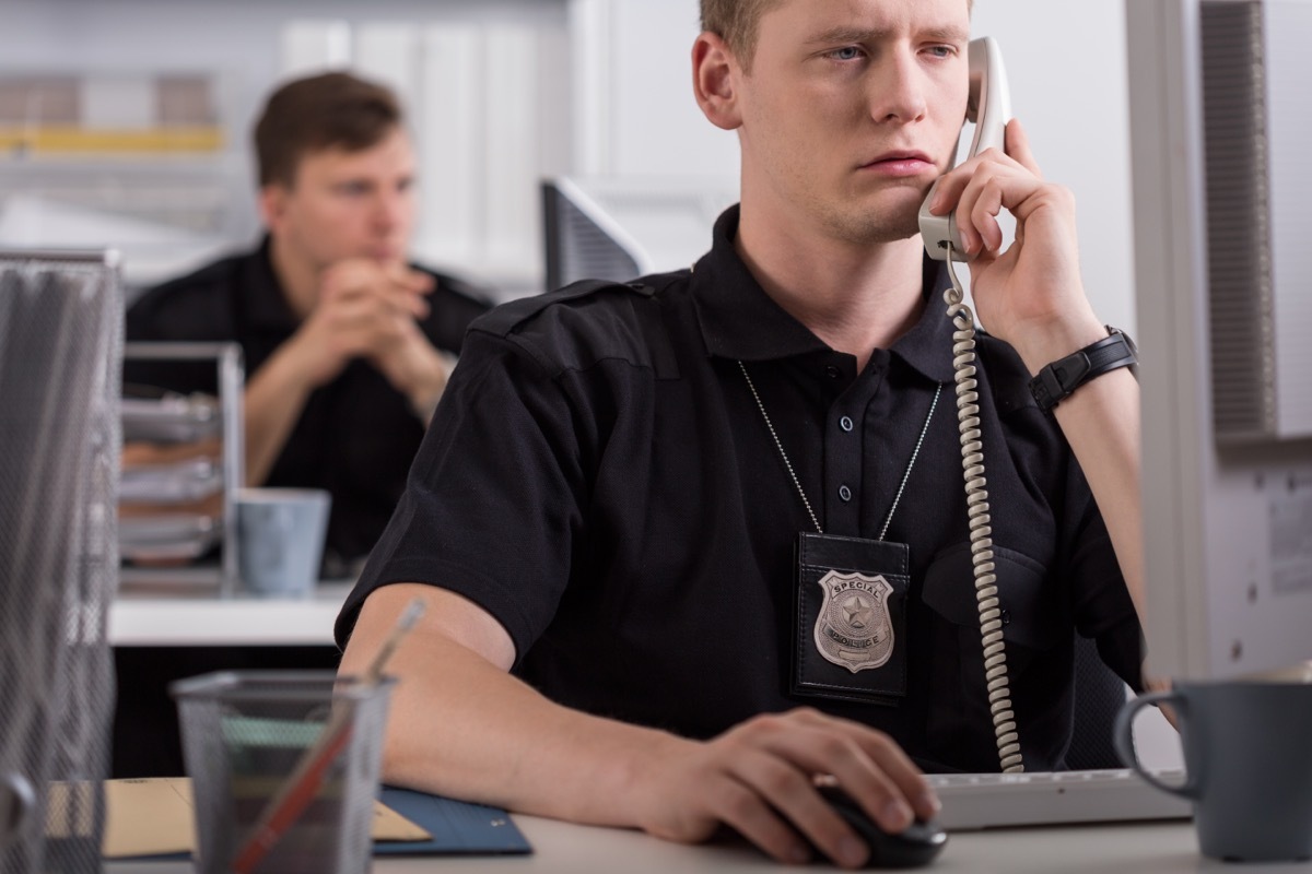 police officer receiving report on phone