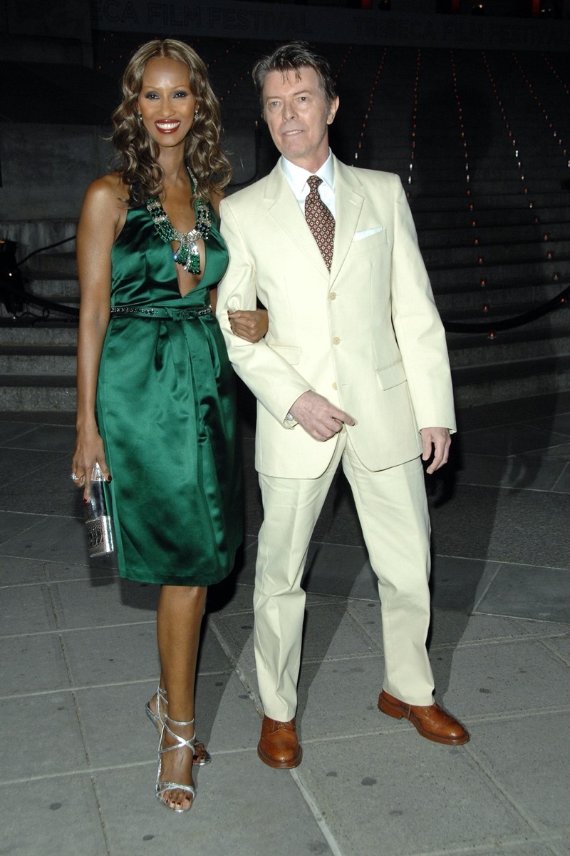 Iman wears a green dress and David Bowie wears an off white suit to the Tribeca Film Festival in 2007