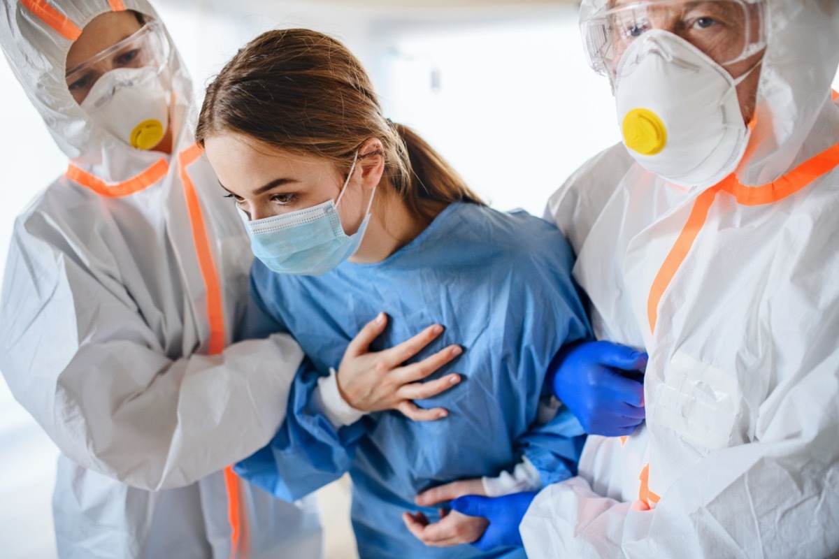 Doctors and infected patient in quarantine in hospita.