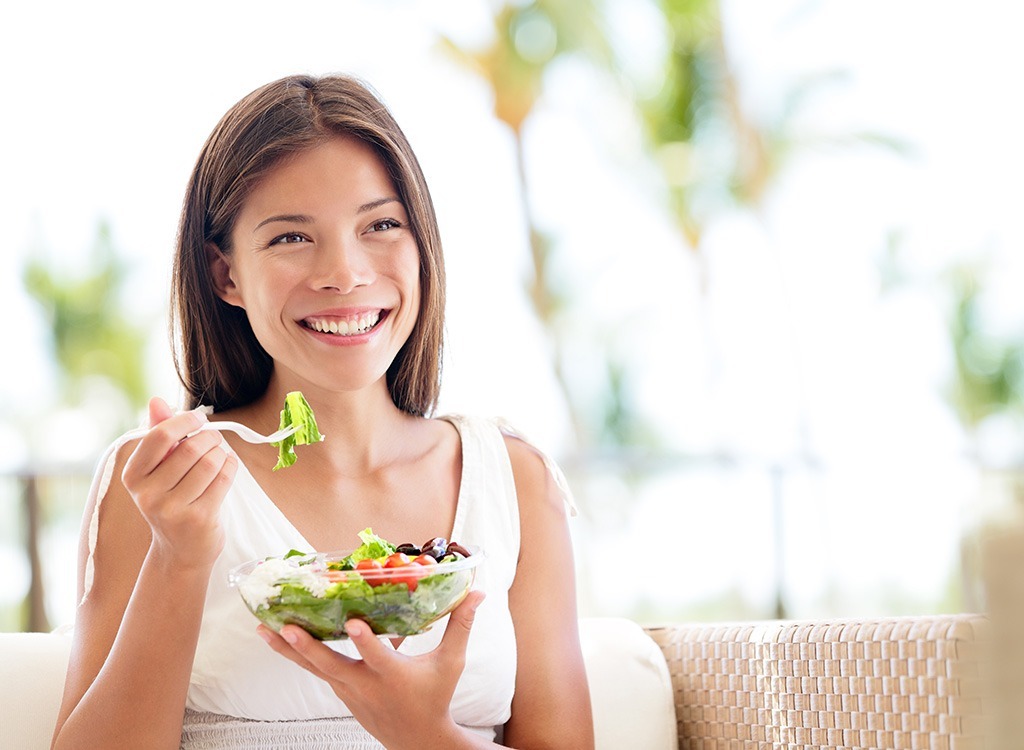 Woman eating salad