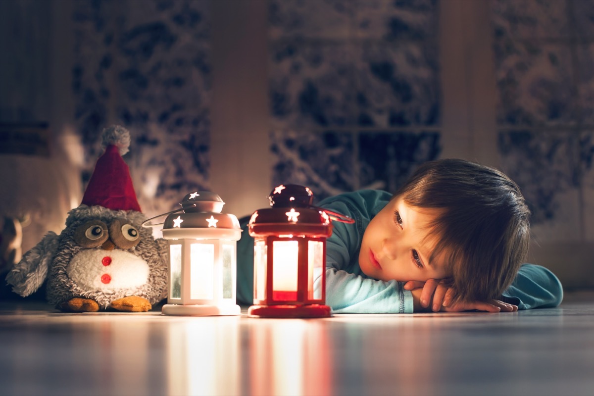 Boy with christmas candles christmas perfectionism