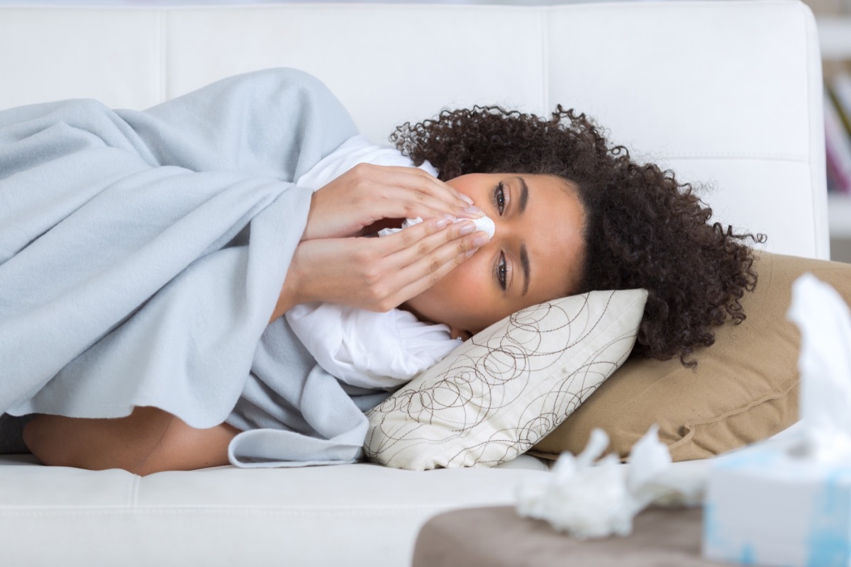 Woman Sniffling Sick with the Flu {what to do if you have the flu}