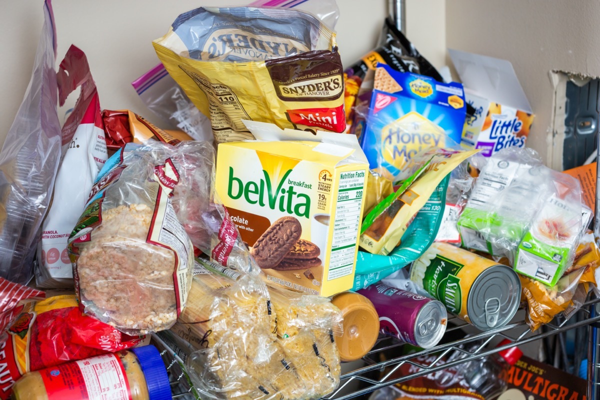 Seattle, California/United States - 10/24/2019: A view inside a food pantry, featuring an array of assorted food and beverage products and packages in a disorganized fashion.