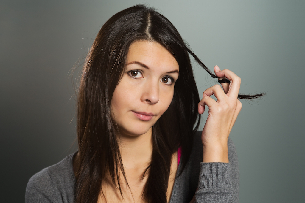 young woman twirling her hair