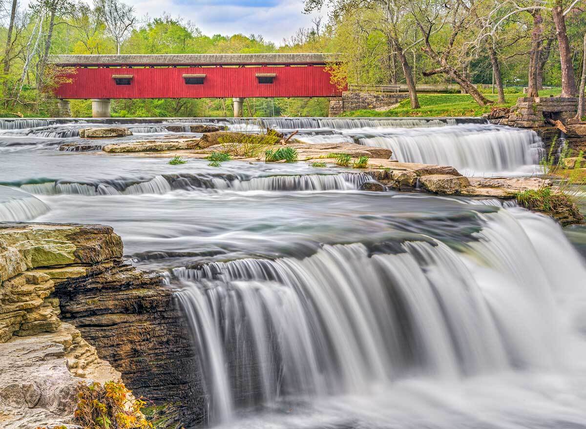 red cataract covered bridge viewed from a low angle