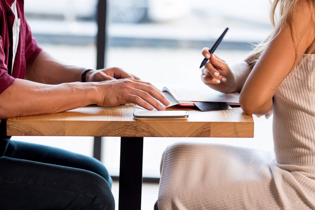 white couple making list