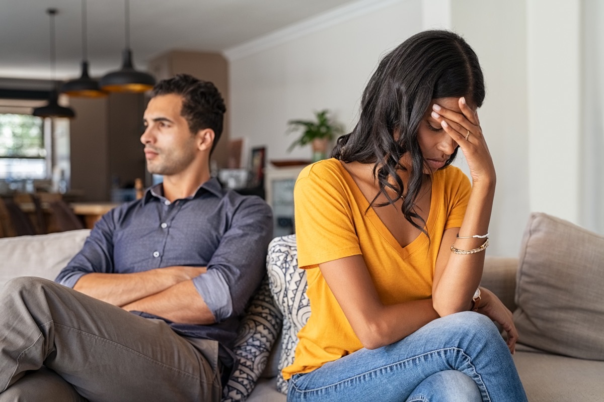 Angry couple ignoring each other, relationship troubles.