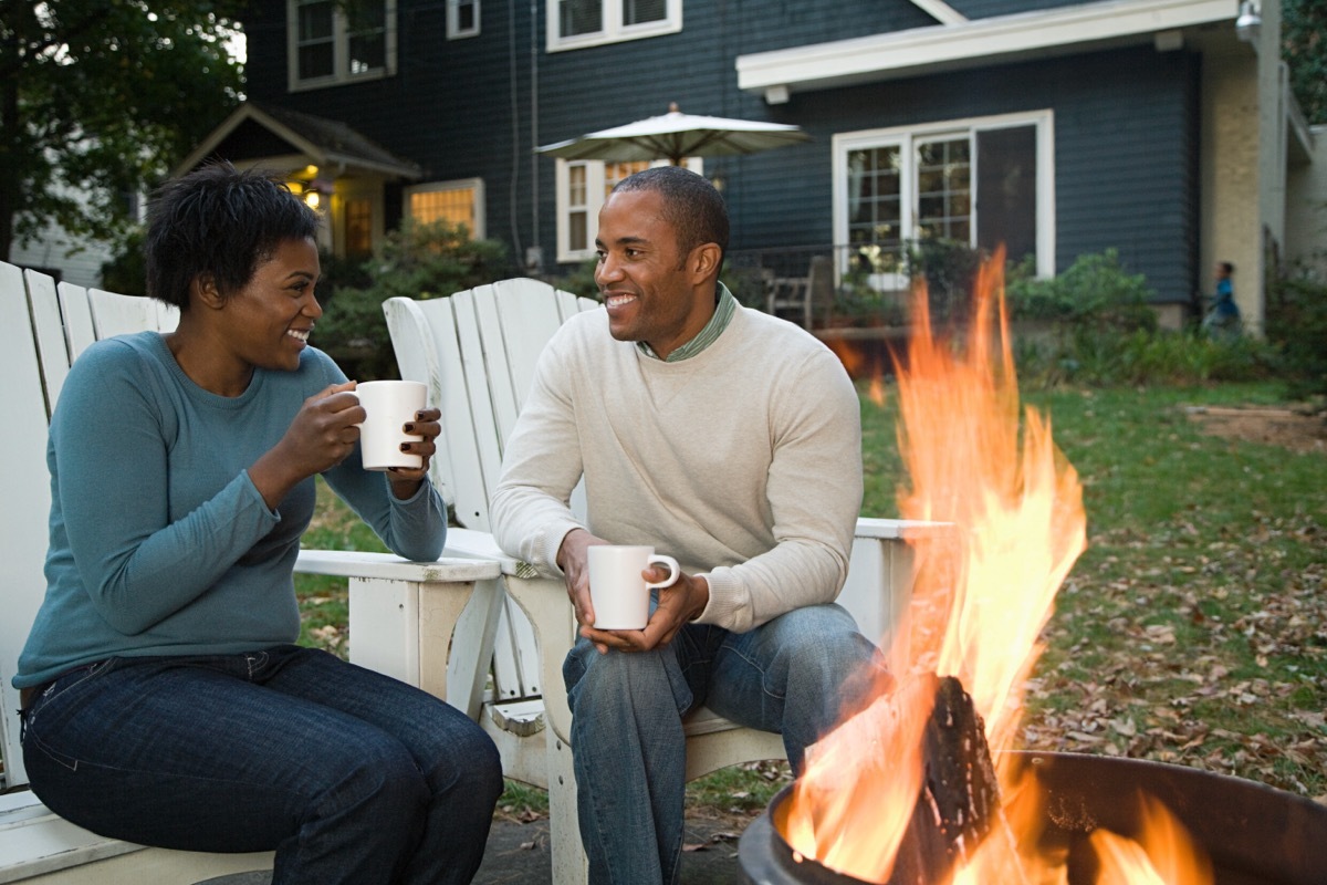 couple sitting by a bonfire