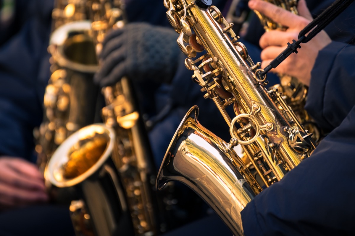 saxophones of a town band during a performance.