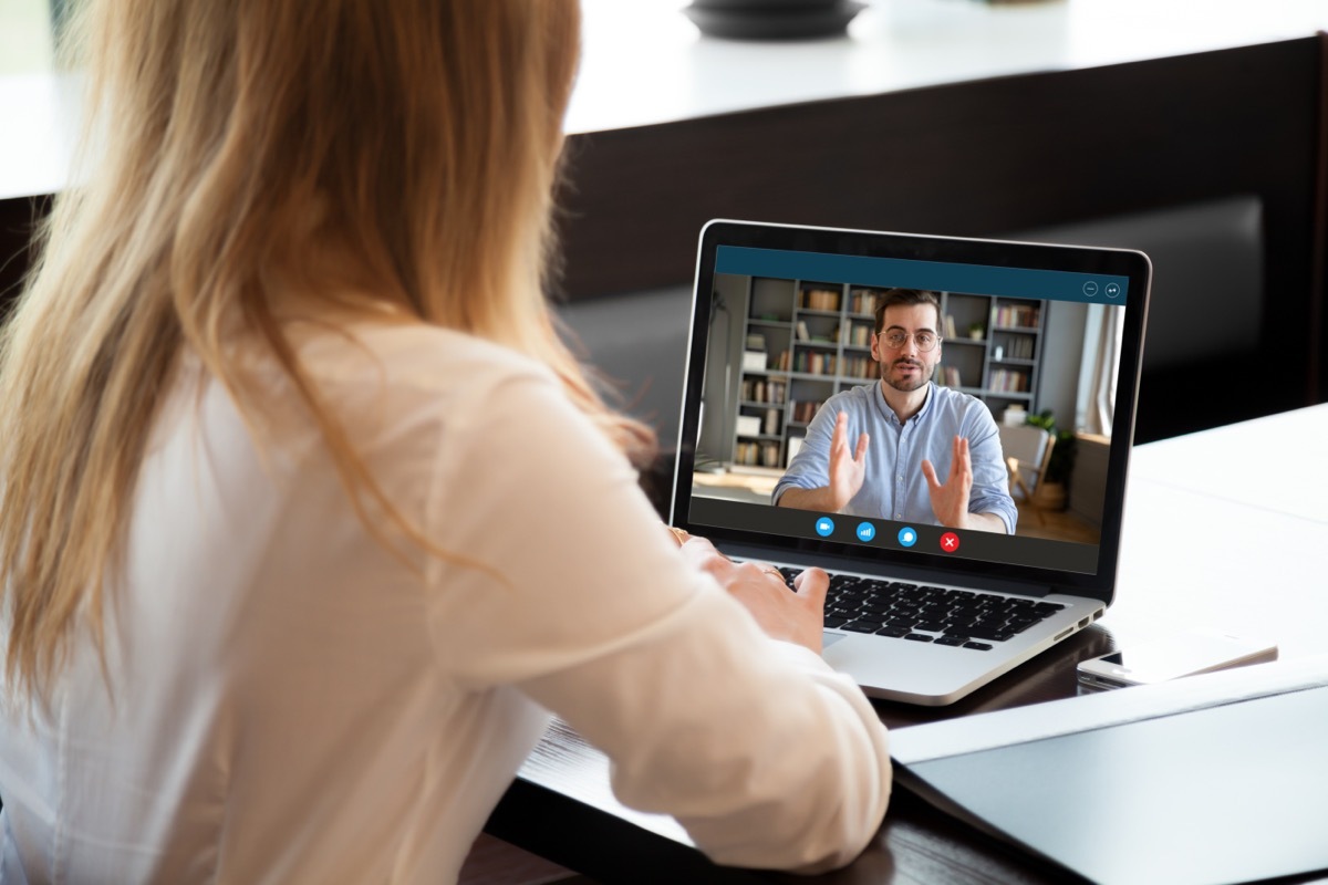 woman having a conversation with a man over Zoom