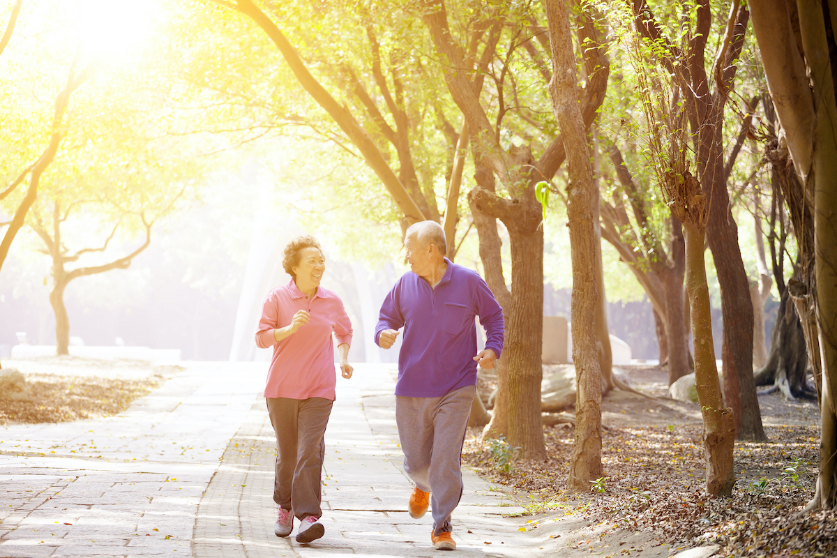 happy Senior Couple Exercising In the Park