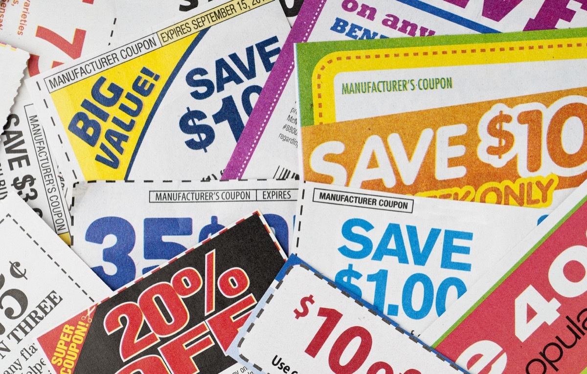 Large stack of money saving coupons.