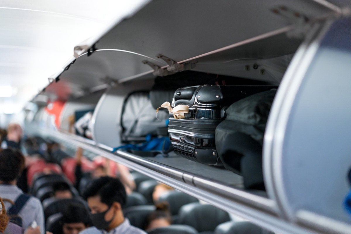 packed luggage on plane