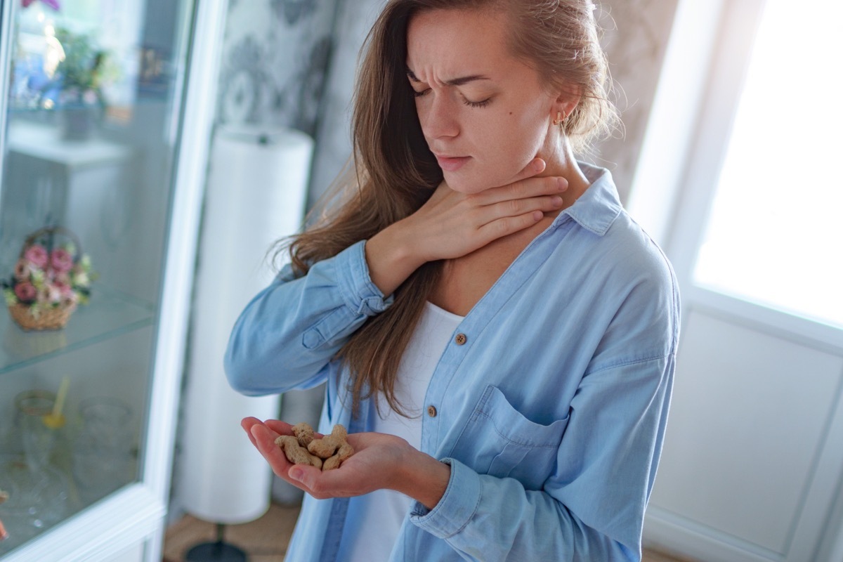 Young Woman Choking on Food