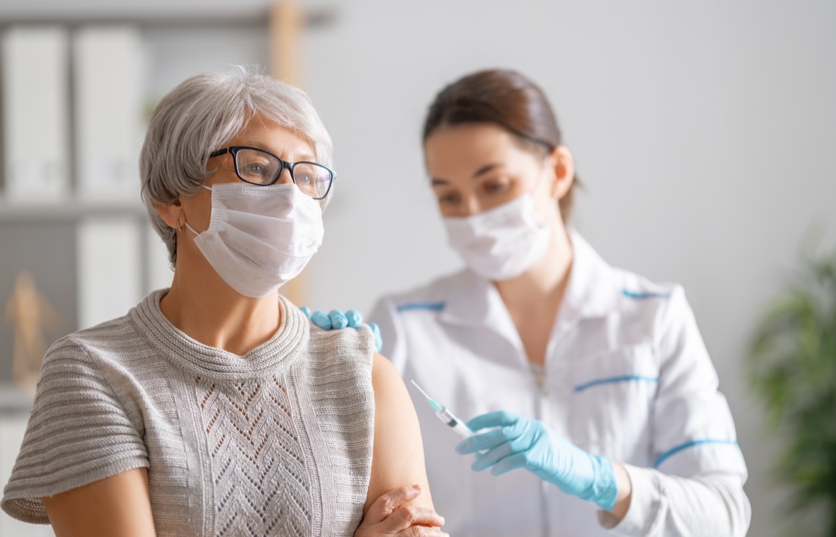 Woman getting COVID vaccine