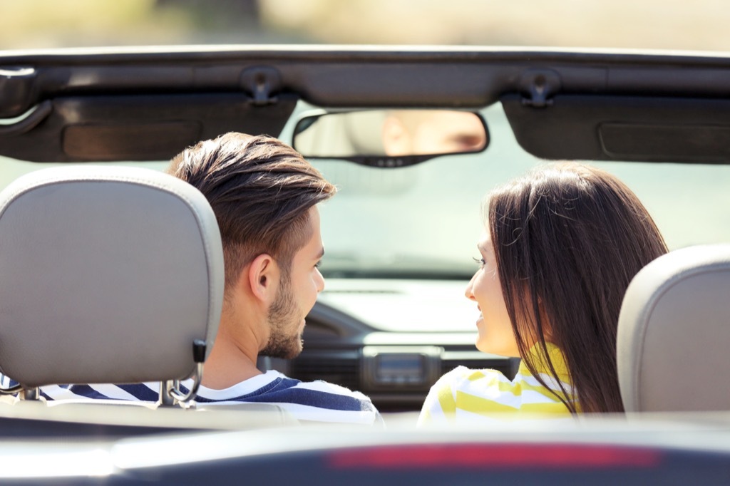 man and woman in convertible, '60s slang