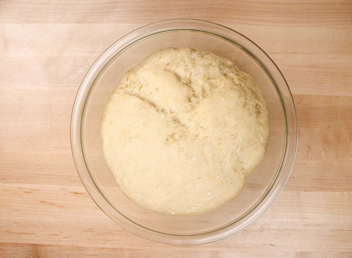 risen dough in a large bowl