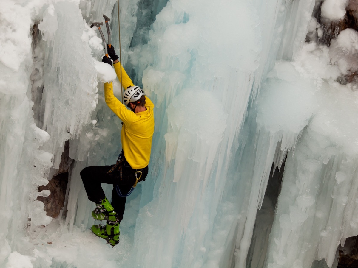 Climber on icy mountain