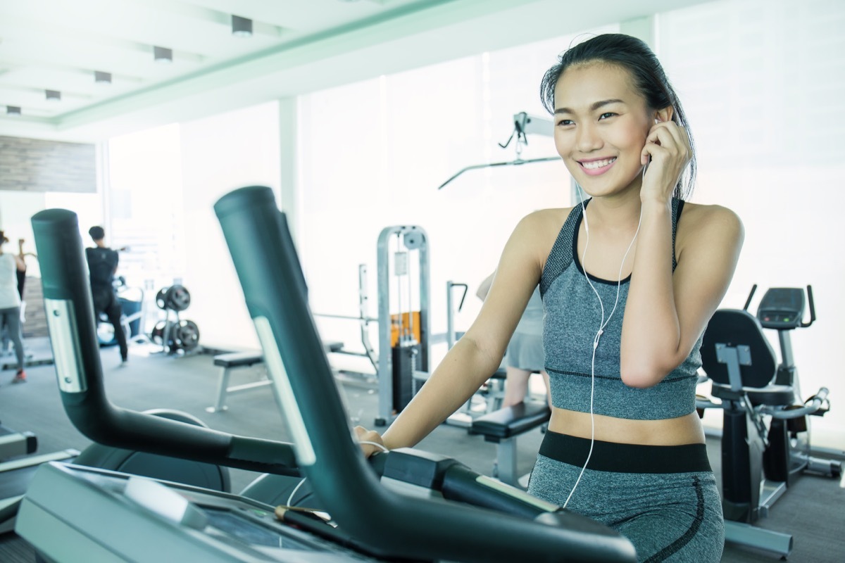 woman on her phone at the gym