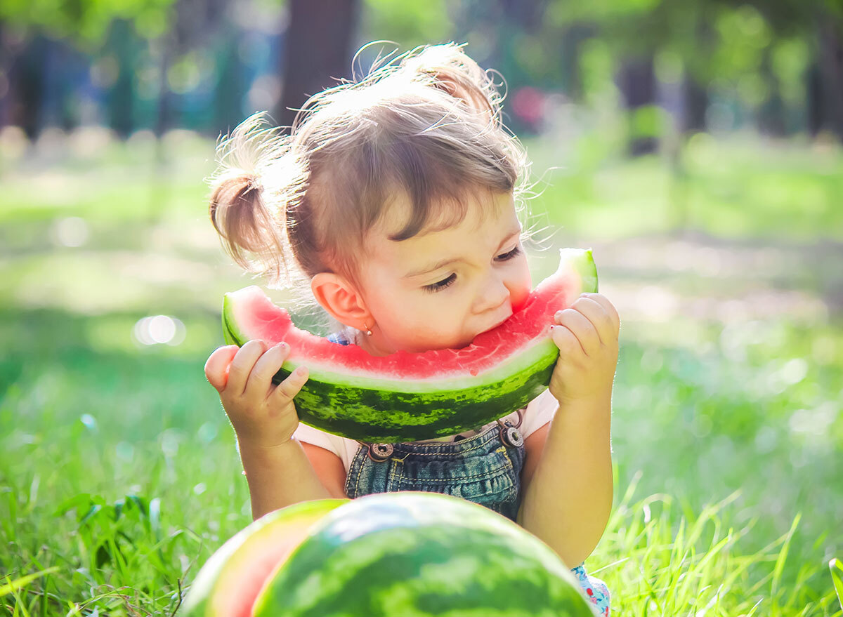 child eating watermelon