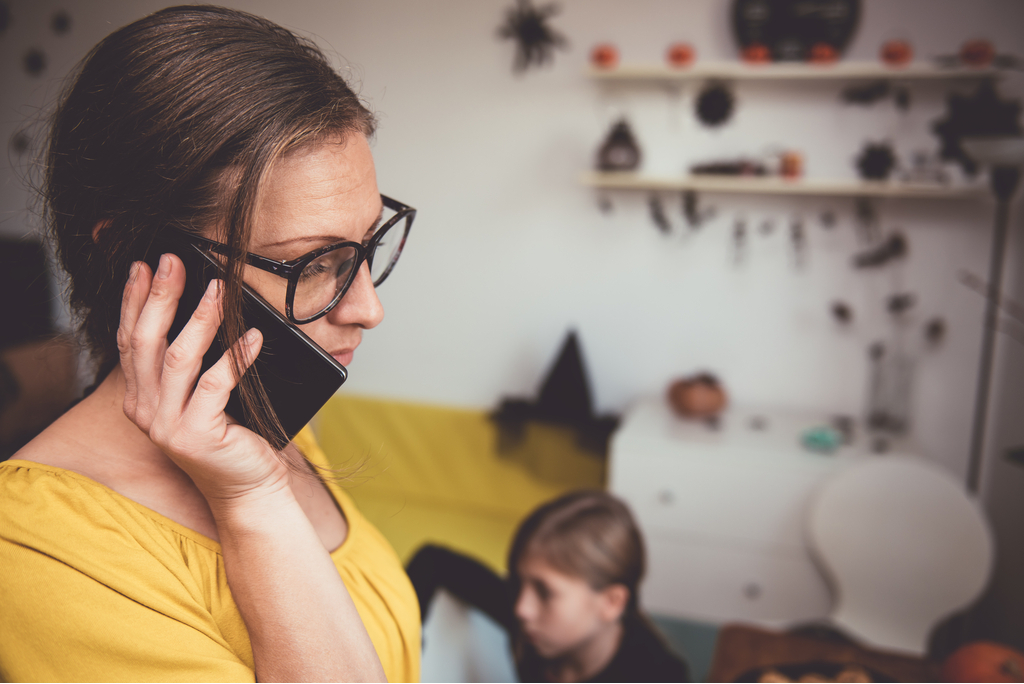 Worried Mother Talking on Phone stay at home mom