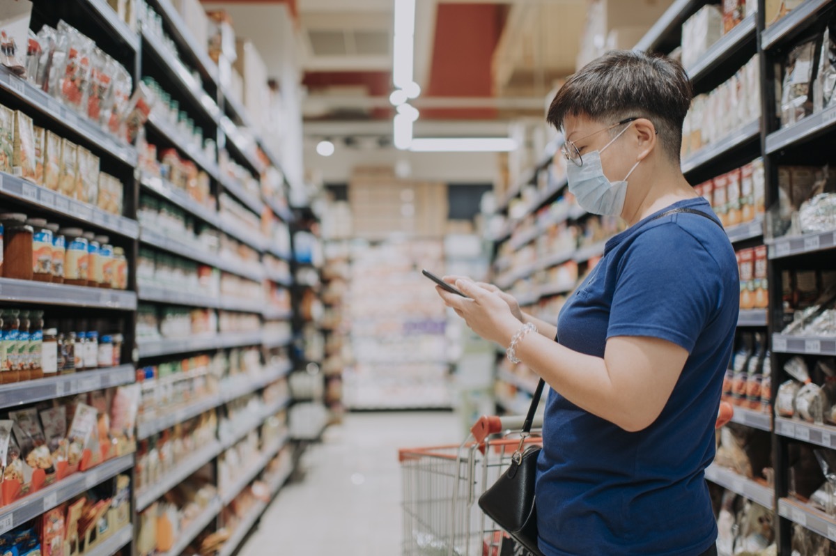 female wearing a mask going out shopping in supermarket