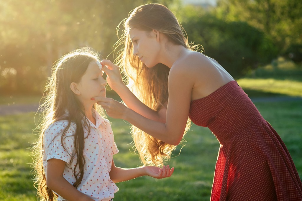 mom wiping daughter's face