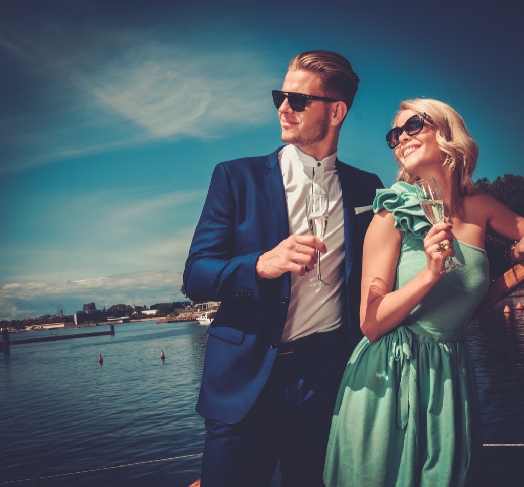 couple drinking champagne on boat advice you should ignore over 40