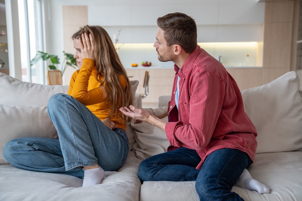 woman pushing partner away during conversation