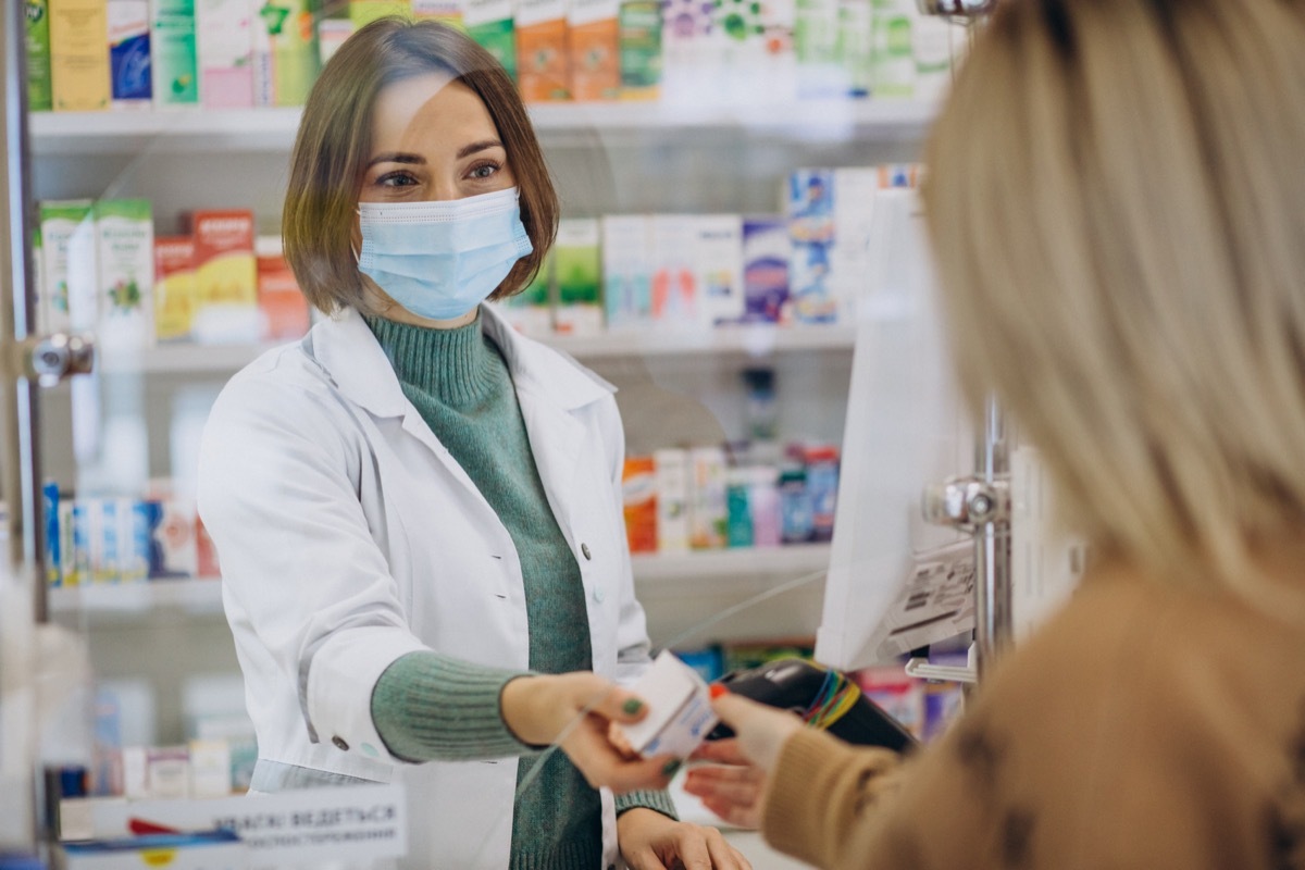 pharmacist filling prescription