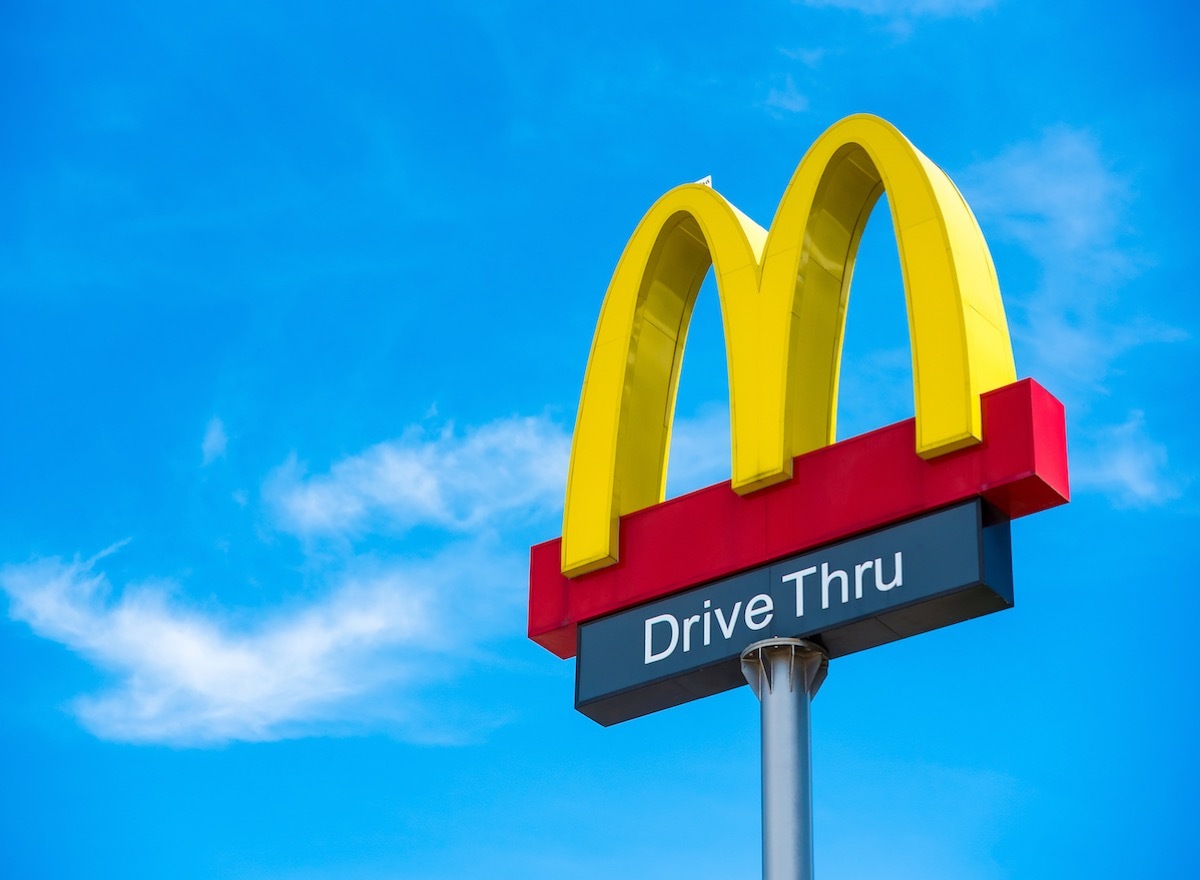 the mcdonalds golden arches set against a bluebird sky