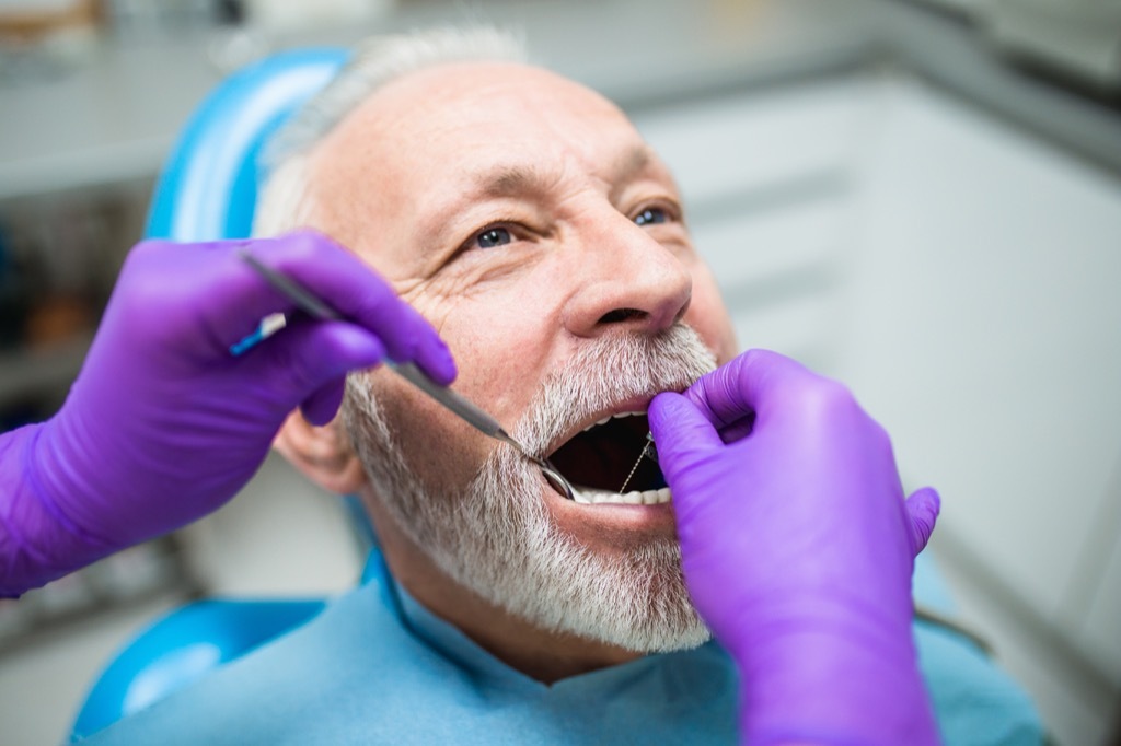 Older Man at the Dentist Getting His Gums Checked, look better after 40