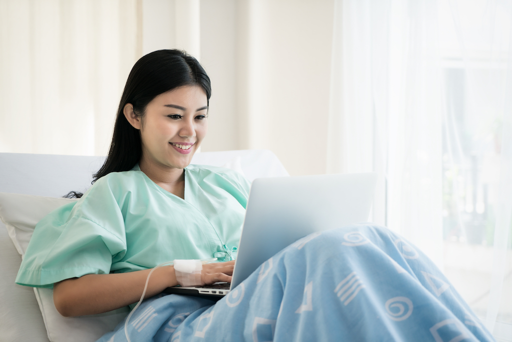 woman working on her laptop from the office