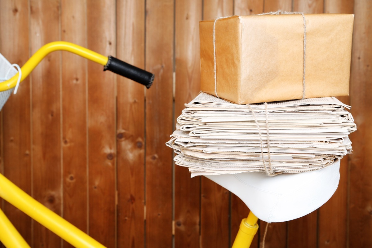 newspapers on the back of a bike, paper route