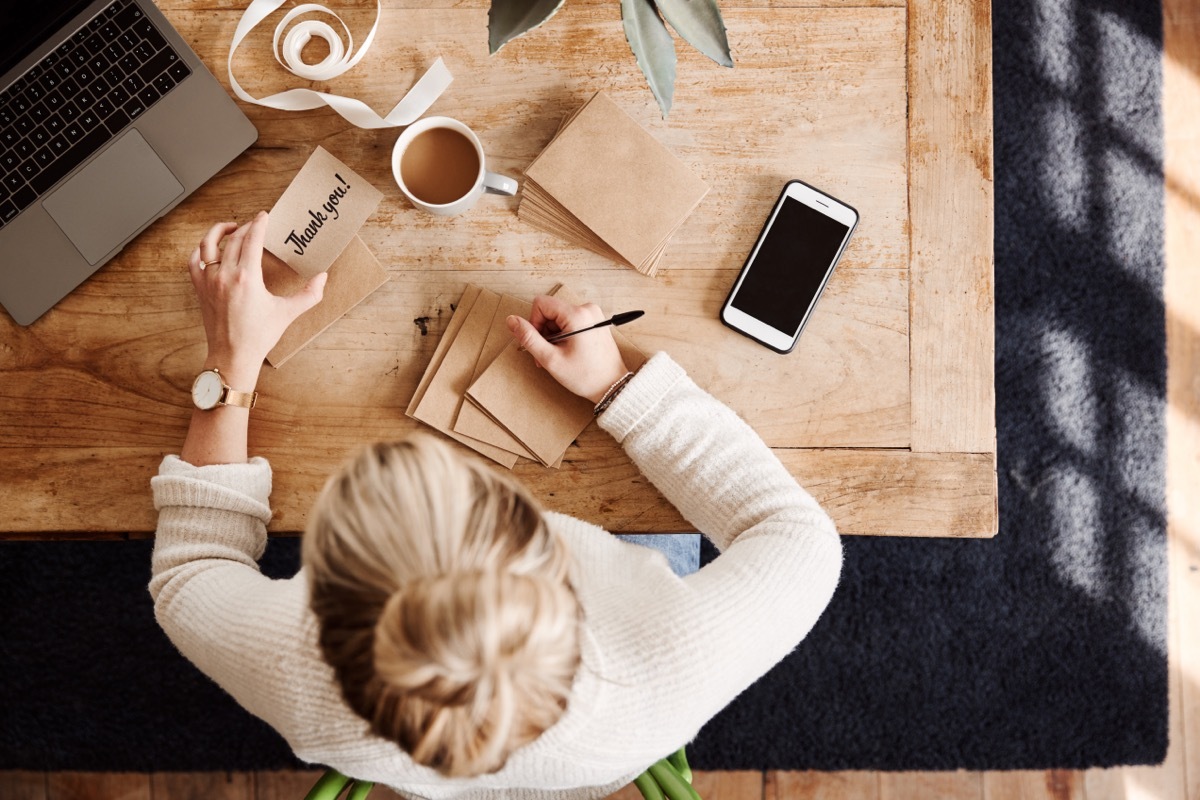 Woman writing a Thank you Note