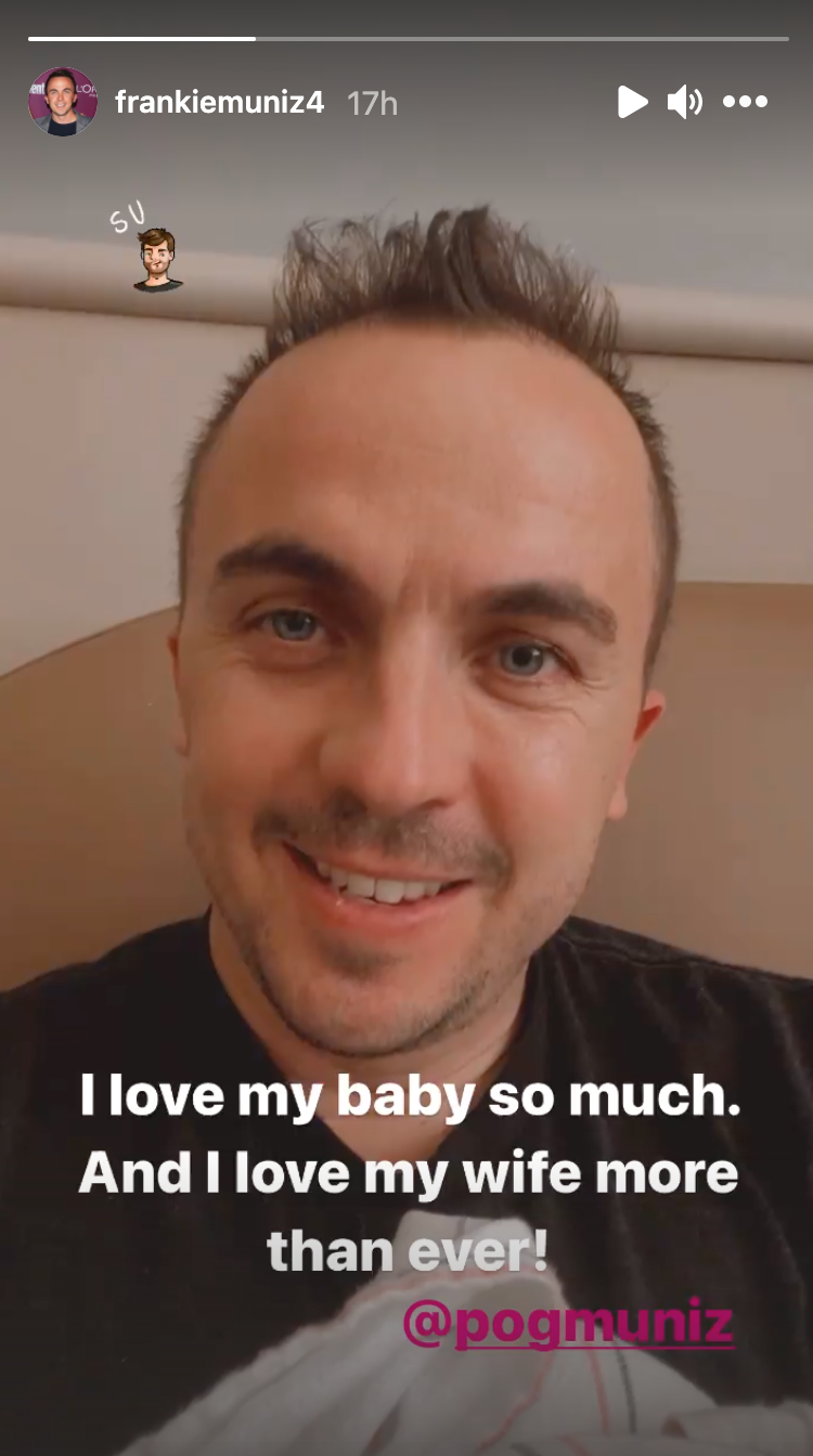 Frankie Muniz holding his baby