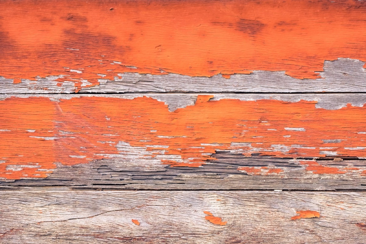 wooden boards with chipped orange paint, interior design mistakes