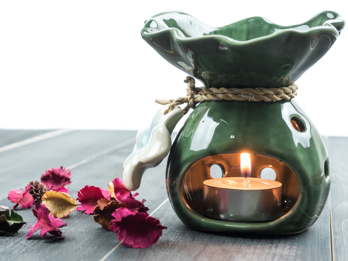 a pot of liquid potpourri on a table