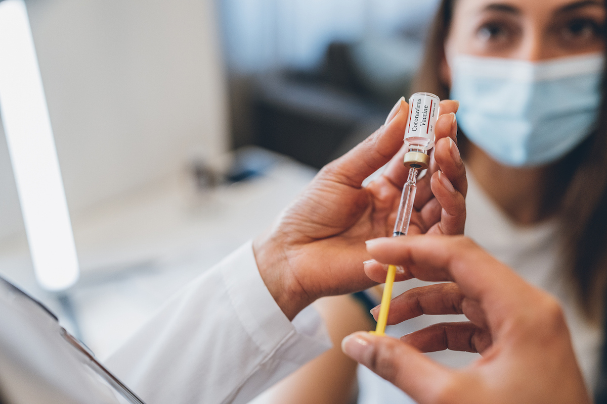 Doctor's hands Preparing injection with covid-19 vaccine