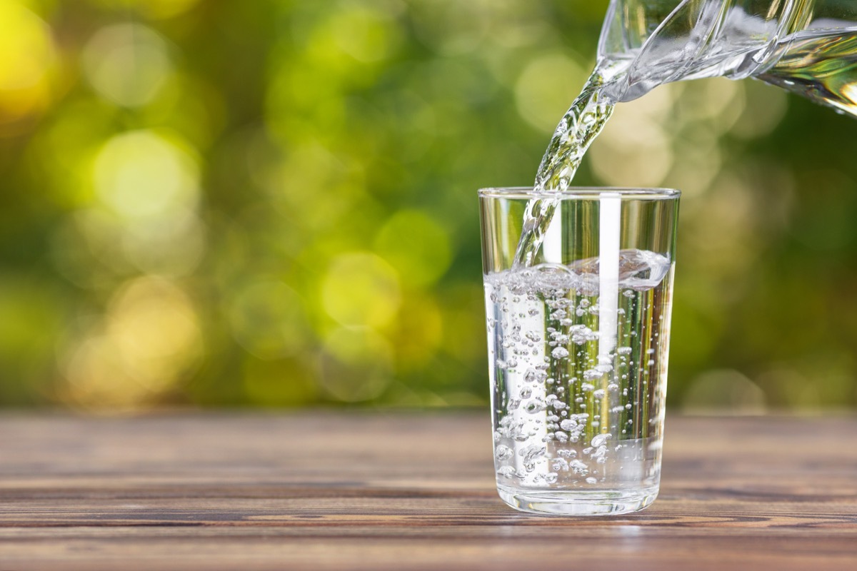 Glass of Water Being Poured