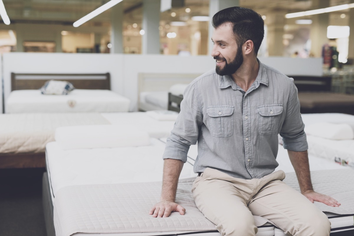 Man shopping for a new mattress