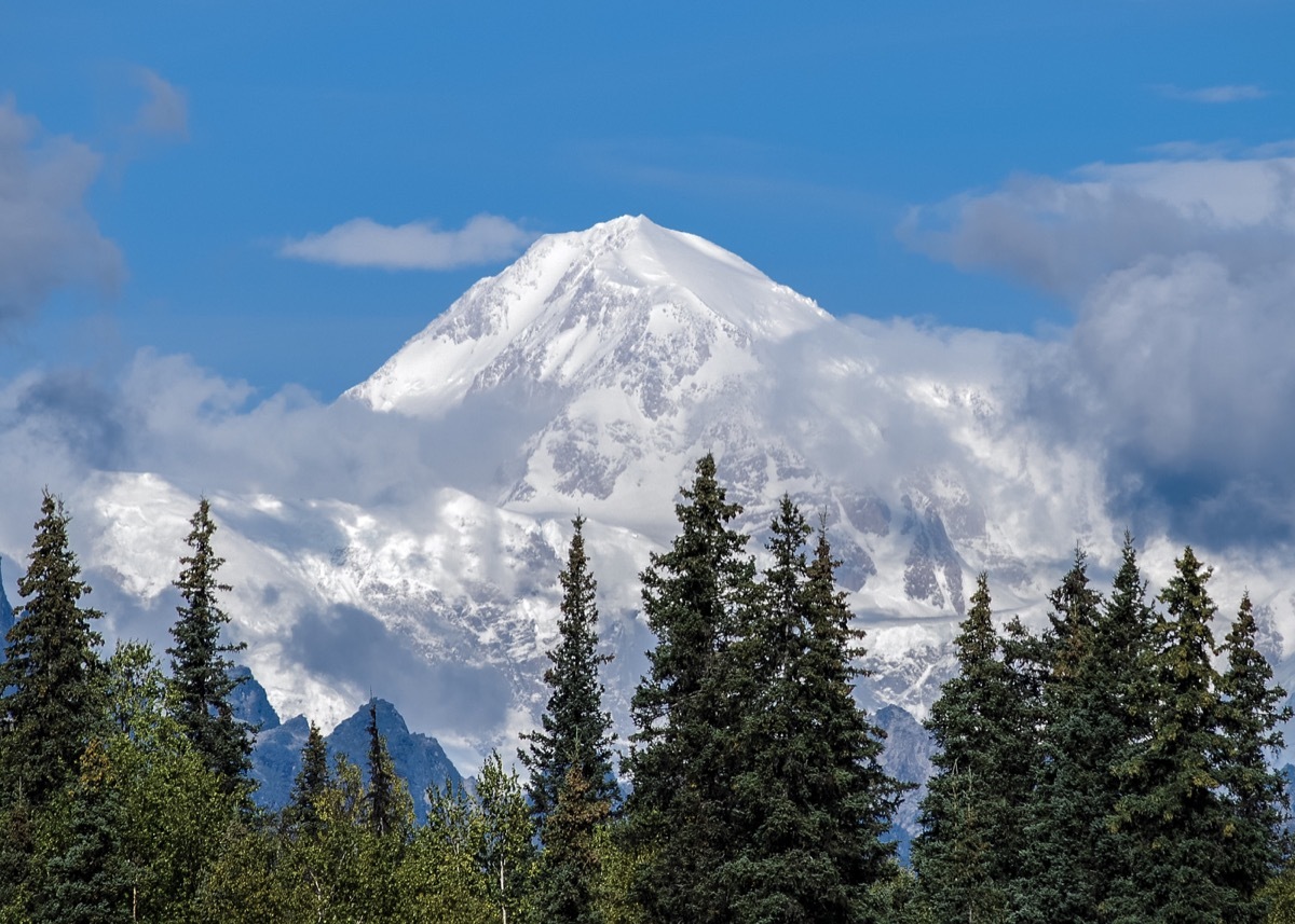 Denali, or Mt. McKinley as many know it, isn't often visible because of clouds. When it does emerge, it's magnificent. This view is from Byers Lake, Alaska.