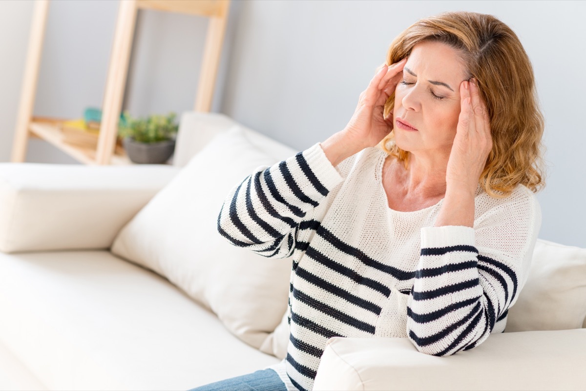 Senior woman feels pain in head