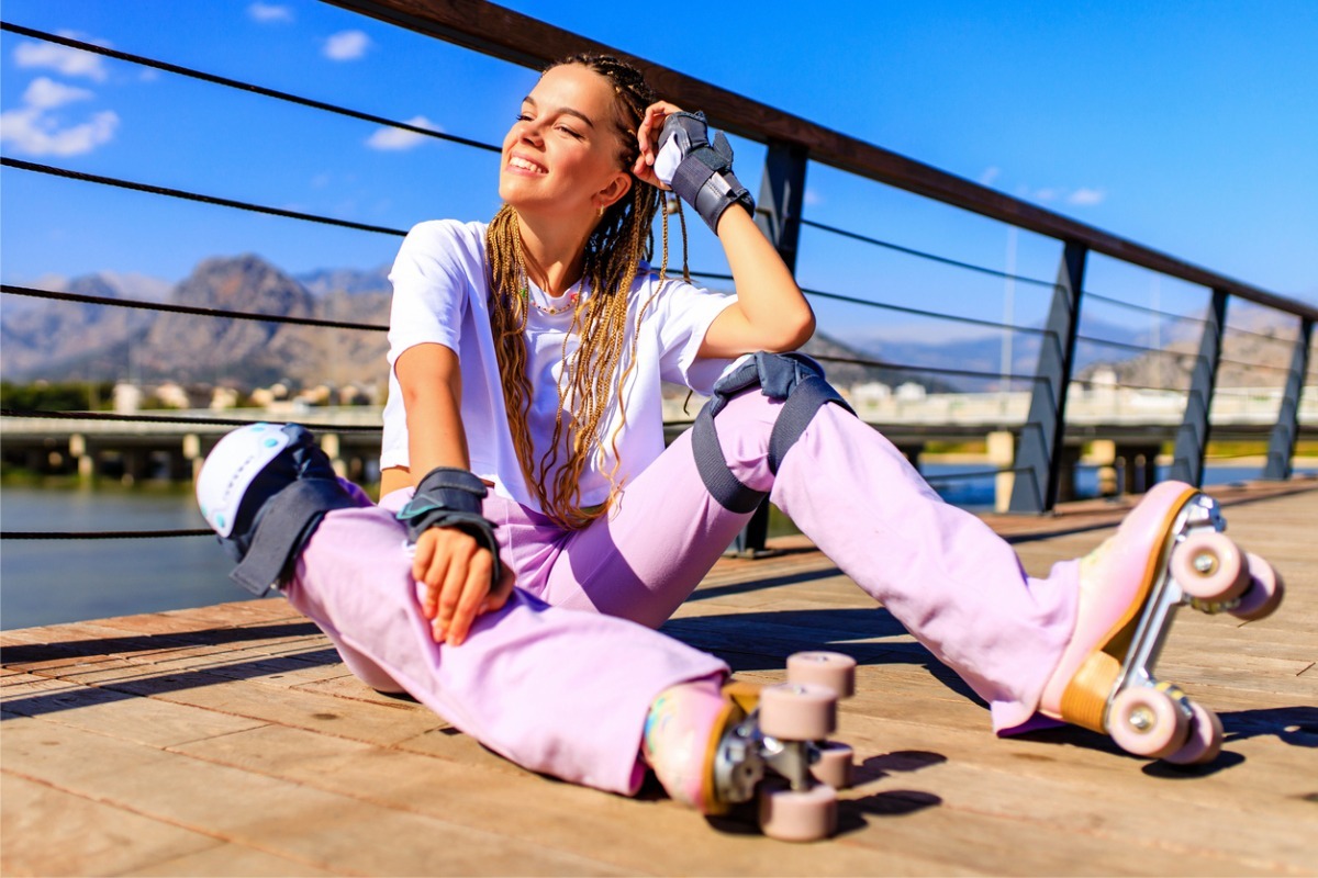 young woman roller skating outside