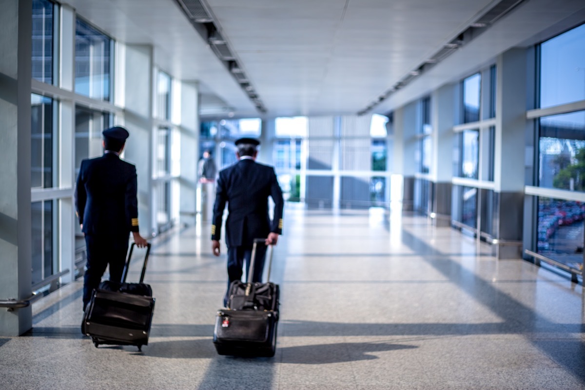 pilots walking through terminal