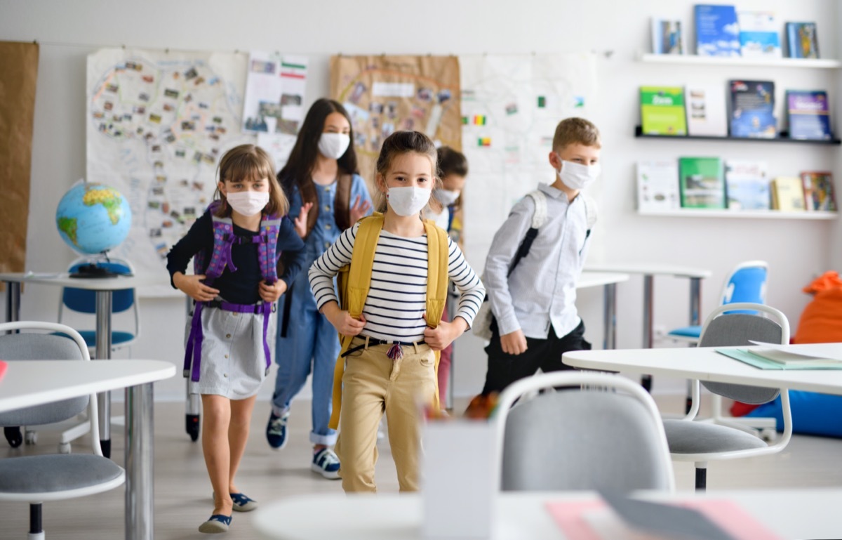 Elementary age school kids at school in mask