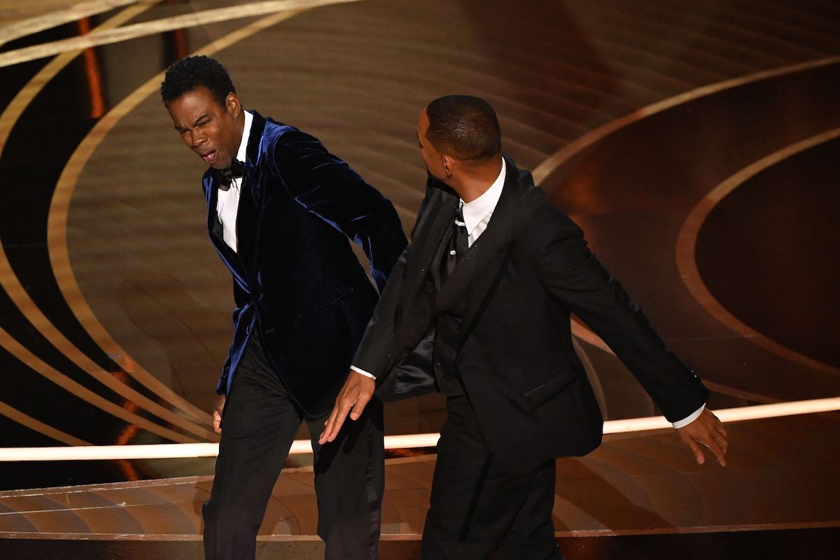 Will Smith slapping Chris Rock on stage at the 2022 Oscars